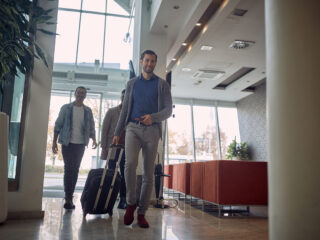 Group of young men in a hotel lobby - Sharon Carr Travel