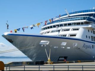 Bow of Oceania Cruise ship Regatta at dock in Seattle - Sharon Carr Travel