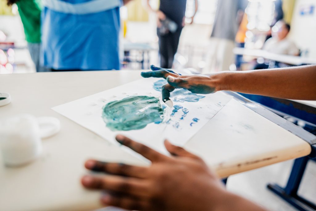 Close-up of a student painting - Sharon Carr Cruises